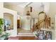 Spacious foyer with tile flooring, grand staircase, and open view to living areas at 14655 S 25Th Way, Phoenix, AZ 85048