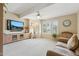 Open living room featuring bright windows, neutral decor, and a comfortable seating area, perfect for relaxation at 14655 S 25Th Way, Phoenix, AZ 85048