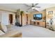 Spacious living room with modern media center, neutral tones, and comfortable seating for a welcoming ambiance at 14655 S 25Th Way, Phoenix, AZ 85048