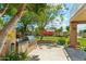 This outdoor kitchen features a stainless steel grill, built-in countertop, and mature landscaping for entertaining at 14655 S 25Th Way, Phoenix, AZ 85048