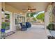 Charming covered patio area with ceiling fan, BBQ, and inviting seating, perfect for outdoor relaxation at 14655 S 25Th Way, Phoenix, AZ 85048