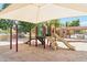 Community playground with shade features slides, climbing structures, and a soft sand surface for safe play at 14655 S 25Th Way, Phoenix, AZ 85048