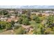 Aerial perspective showcases a spacious backyard, mature trees, and surrounding neighborhood at 154 E Redfield Rd, Chandler, AZ 85225