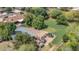 Large green backyard with a utility shed, utility vehicles, and mature trees creates a private, outdoor oasis at 154 E Redfield Rd, Chandler, AZ 85225