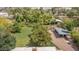 Large backyard with tool shed and mature trees providing ample shade and natural beauty to the serene setting at 154 E Redfield Rd, Chandler, AZ 85225