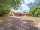 Large backyard featuring mature trees, a covered patio, and plenty of space at 154 E Redfield Rd, Chandler, AZ 85225