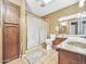 Classic bathroom featuring neutral tile, a vanity, toilet, and glass enclosed shower at 154 E Redfield Rd, Chandler, AZ 85225