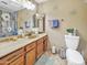 Classic bathroom with modern fixtures, vanity, toilet, and shower at 154 E Redfield Rd, Chandler, AZ 85225