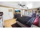 Large bedroom with dual ceiling fans, tile flooring, and glass doors to the backyard at 154 E Redfield Rd, Chandler, AZ 85225