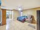 Spacious bedroom with tile floors, walk-in closet, ceiling fan and recliner at 154 E Redfield Rd, Chandler, AZ 85225