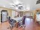 Open dining area with ceiling fans and stainless steel refrigerator in the background at 154 E Redfield Rd, Chandler, AZ 85225