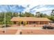 Suburban house showing mature yellow trees and a circular driveway to a charming ranch-style home with a long porch at 154 E Redfield Rd, Chandler, AZ 85225