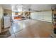 Spacious garage with storage cabinets, laundry area, and overhead door at 154 E Redfield Rd, Chandler, AZ 85225