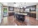 Spacious kitchen features a large island, granite countertops, and stainless steel appliances at 154 E Redfield Rd, Chandler, AZ 85225