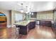 Bright kitchen features stainless steel appliances, granite countertops, and a large kitchen island at 154 E Redfield Rd, Chandler, AZ 85225