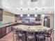 Bright kitchen features stainless steel appliances, granite countertops, and a large kitchen island at 154 E Redfield Rd, Chandler, AZ 85225