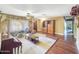 Comfortable living room with large window for natural light, and a ceiling fan at 154 E Redfield Rd, Chandler, AZ 85225