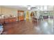 Spacious living room leading to the kitchen and dining area with wooden floors at 154 E Redfield Rd, Chandler, AZ 85225