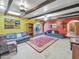 Cozy living room featuring exposed beams, arched openings, and comfortable seating at 154 E Redfield Rd, Chandler, AZ 85225