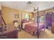 Bedroom features red patterned comforter, dresser, and ceiling fan at 154 E Redfield Rd, Chandler, AZ 85225