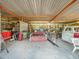 Covered outbuilding with storage, equipment, and concrete floor at 154 E Redfield Rd, Chandler, AZ 85225