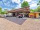 Outbuilding with covered parking, open storage, and gravel driveway at 154 E Redfield Rd, Chandler, AZ 85225