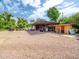 Wide view of the property with an outbuilding with covered parking and storage at 154 E Redfield Rd, Chandler, AZ 85225