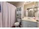 Cozy bathroom featuring built-in storage, and a shower for convenience at 16661 W Belleview St, Goodyear, AZ 85338