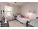 Cozy bedroom features a comfortable bed, soft rug, and natural light for a serene space at 16661 W Belleview St, Goodyear, AZ 85338
