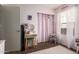 Charming bedroom featuring a vanity, natural light, and stylish decor for a serene atmosphere at 16661 W Belleview St, Goodyear, AZ 85338