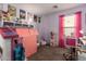 Bedroom featuring pink curtains, desk and a variety of toys at 16661 W Belleview St, Goodyear, AZ 85338