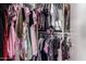 Walk-in closet filled with a variety of clothing items at 16661 W Belleview St, Goodyear, AZ 85338