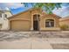 Charming single story home featuring a two car garage, low maintenance landscaping, and a welcoming front porch at 16661 W Belleview St, Goodyear, AZ 85338