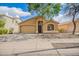 Charming single story home featuring a two car garage, low maintenance landscaping, and a welcoming front porch at 16661 W Belleview St, Goodyear, AZ 85338