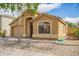 Charming single story home featuring a two car garage, low maintenance landscaping, and a welcoming front porch at 16661 W Belleview St, Goodyear, AZ 85338