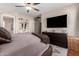 Main bedroom featuring neutral walls, ceiling fan, vanity area and dresser at 16661 W Belleview St, Goodyear, AZ 85338
