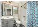 Clean bathroom featuring a gray vanity, tub-shower combo, and updated fixtures at 1689 E Elgin St, Gilbert, AZ 85295