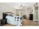 Cozy bedroom with neutral colors, ceiling fan, and bright natural light at 1689 E Elgin St, Gilbert, AZ 85295
