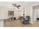 Bright bonus room featuring neutral walls, ceiling fan, and comfortable seating at 1689 E Elgin St, Gilbert, AZ 85295