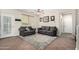 Comfortable living room featuring neutral tones, plush seating, and a stylish area rug at 1689 E Elgin St, Gilbert, AZ 85295
