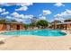 Community pool with seating, cabana, and lush landscaping, perfect for outdoor relaxation at 1689 E Elgin St, Gilbert, AZ 85295