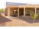 Inviting covered back patio with gravel landscaping and solar panels above at 17911 N Adobe Mesa Ct, Surprise, AZ 85374