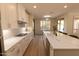 Modern kitchen with white cabinets, an island, and stainless steel appliances at 17911 N Adobe Mesa Ct, Surprise, AZ 85374