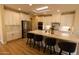 Bright kitchen with quartz countertops, white cabinetry, and a large island at 17911 N Adobe Mesa Ct, Surprise, AZ 85374