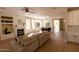 Spacious living room with fireplace, wood floors, and bright natural light at 17911 N Adobe Mesa Ct, Surprise, AZ 85374