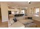 Spacious living area features a modern kitchen, comfortable seating, and great natural light at 17911 N Adobe Mesa Ct, Surprise, AZ 85374