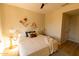 Comfortable main bedroom with natural lighting, a ceiling fan, and modern decor at 17911 N Adobe Mesa Ct, Surprise, AZ 85374