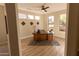 Home office featuring ample natural light, wood flooring, and contemporary decor at 17911 N Adobe Mesa Ct, Surprise, AZ 85374