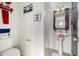 Bathroom featuring a pedestal sink, toilet, decorative accents, and neutral paint at 17970 N 114Th Ln, Surprise, AZ 85378