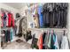Walk-in closet with ample shelving and hanging space for organized storage at 17970 N 114Th Ln, Surprise, AZ 85378